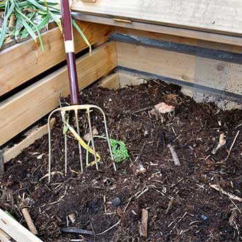 speed up the compost by rotating it